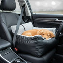 DreammyDoggie black dog car booster seat with a cozy grey interior, featuring a golden puppy sleeping comfortably.