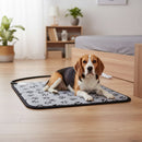DreammyDoggie electric heating pad with grey paw print pattern, featuring a beagle resting comfortably on a wooden floor.