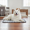 DreammyDoggie electric heating pad with paw print pattern under a fluffy white Samoyed dog on a wooden floor