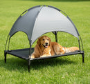 DreammyDoggie elevated cooling dog bed with a grey canopy, featuring a golden retriever resting on a mesh platform.