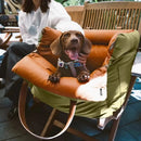DreammyDoggie luxury faux leather booster dog car seat in olive green and tan with a happy dachshund sitting inside