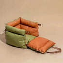 DreammyDoggie luxury faux leather booster dog car seat in olive green and orange with a fold-out plush cushion