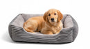 DreammyDoggie rectangle dog sofa bed in grey corduroy with a plush interior, featuring a golden retriever puppy resting.