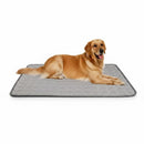 Golden Retriever resting on a grey DreammyDoggie self-cooling gel mat for dogs on a white background