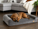 DreammyDoggie grey orthopedic dog sofa bed with plush bolster and memory foam, featuring a large dog resting on it.