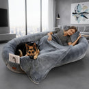 DreammyDoggie luxury human dog bed in grey plush fabric with a woman and German Shepherd resting together indoors
