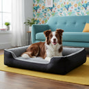 DreammyDoggie large black and grey washable dog bed with plush interior and raised edges, featuring a resting dog.