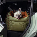 DreammyDoggie olive green and orange faux leather booster dog car seat with a French Bulldog sitting inside