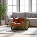 DreammyDoggie olive green and tan faux leather booster dog car seat with plush interior padding in a living room.