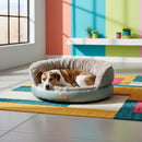 DreammyDoggie round plush dog sofa bed in light blue with a cozy tan interior, featuring a dog resting inside.