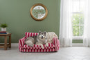 DreammyDoggie striped faux fur pet sofa with a large fluffy dog resting comfortably in a cozy living room setting.
